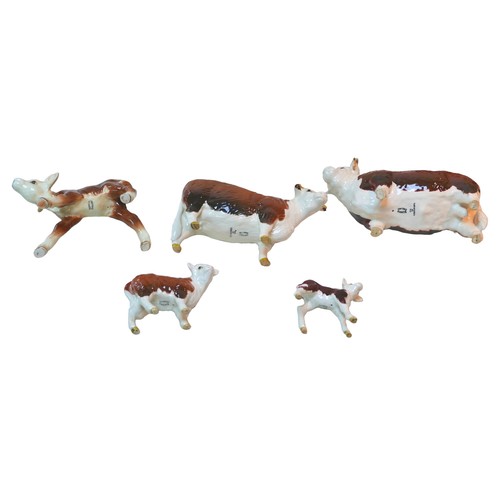 85 - Five Beswick Hereford cattle figurines, comprising 'Champion of champions' Bull, 11.5cm high, a Mare... 