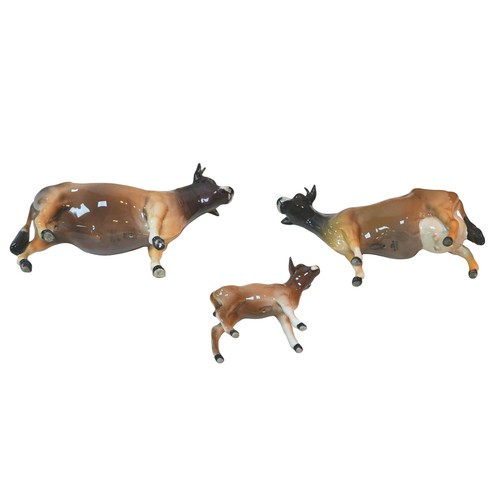 86 - Three Beswick figurines of Jersey cattle, comprising bull 'Dunsley Coy Boy', 11cm high, a cow 'Newto... 