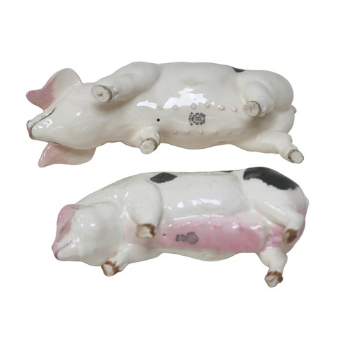 83 - Two Beswick figurines of Old Spot pigs, both sows, largest 8.5cm high, smallest, 7.5cm high. (2)