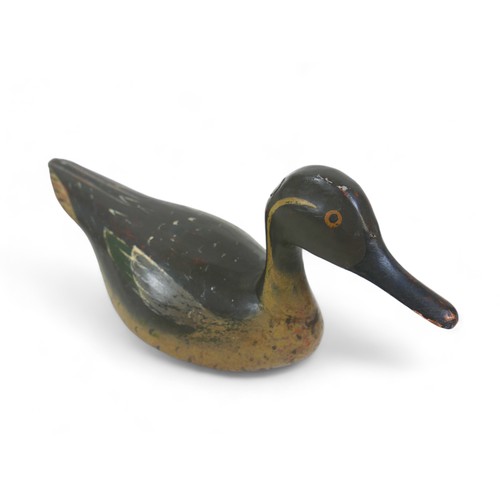 168 - A well carved and painted decoy duck, 35cm by 13cm by 17m tall.