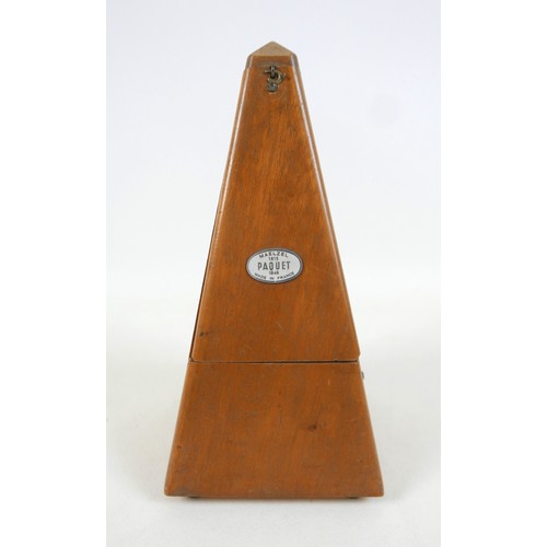 149 - A French metronome by Paquet, 11cm by 11cm by 22cm tall.