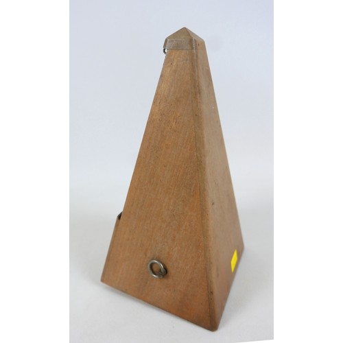 149 - A French metronome by Paquet, 11cm by 11cm by 22cm tall.