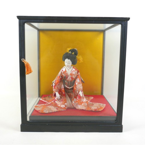 187 - A Japanese Geisha girl doll in display case, 41 by 36 by 44cm high.