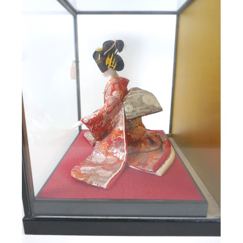 187 - A Japanese Geisha girl doll in display case, 41 by 36 by 44cm high.