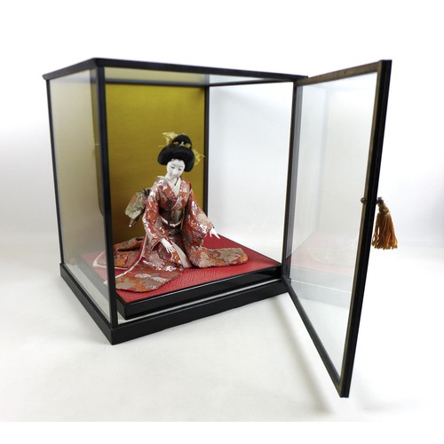 187 - A Japanese Geisha girl doll in display case, 41 by 36 by 44cm high.