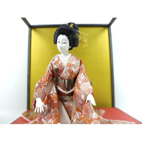 187 - A Japanese Geisha girl doll in display case, 41 by 36 by 44cm high.