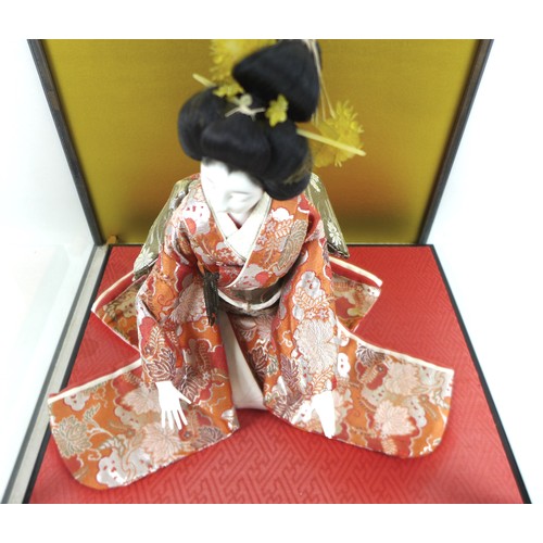 187 - A Japanese Geisha girl doll in display case, 41 by 36 by 44cm high.