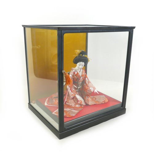 187 - A Japanese Geisha girl doll in display case, 41 by 36 by 44cm high.