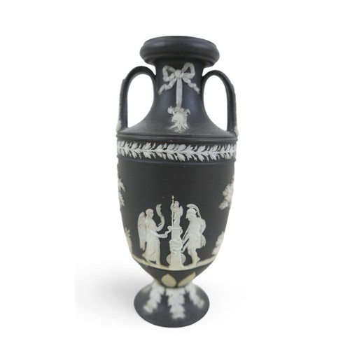 71 - A small Wedgwood black jasper ware twin handle vase 6cm diameter by 13cm tall.