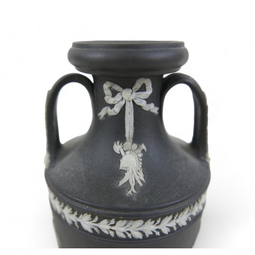 71 - A small Wedgwood black jasper ware twin handle vase 6cm diameter by 13cm tall.