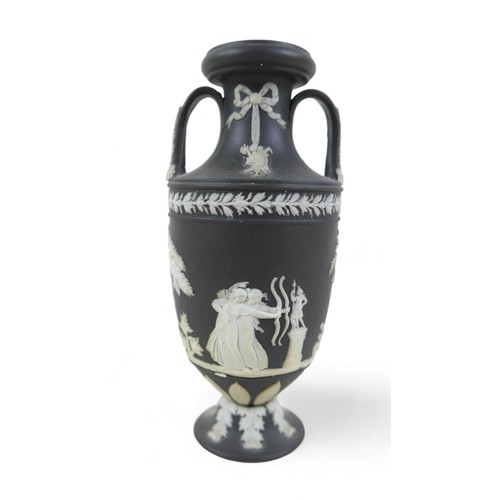 71 - A small Wedgwood black jasper ware twin handle vase 6cm diameter by 13cm tall.