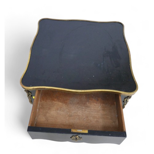 656 - A pair of French, early 20th century ebonised side tables, the square surfaces with serpentine brass... 