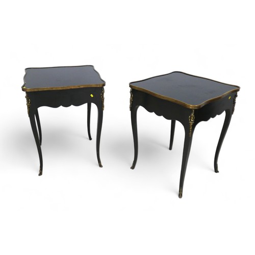 656 - A pair of French, early 20th century ebonised side tables, the square surfaces with serpentine brass... 