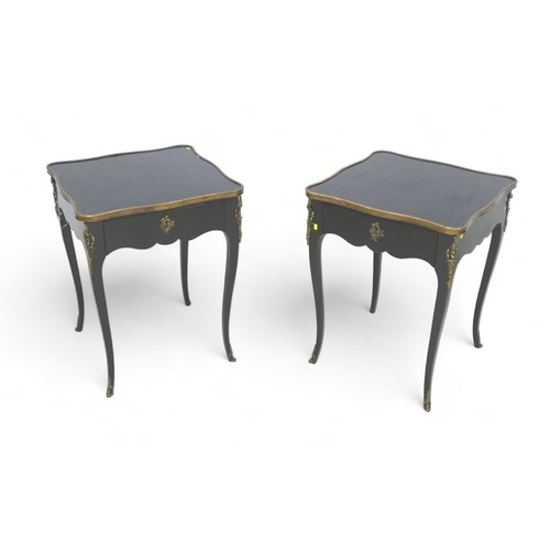 656 - A pair of French, early 20th century ebonised side tables, the square surfaces with serpentine brass... 