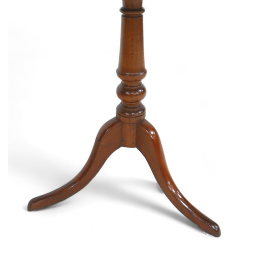 600 - A tripod tilt top tea table, 76 by 60 by 73cm high.