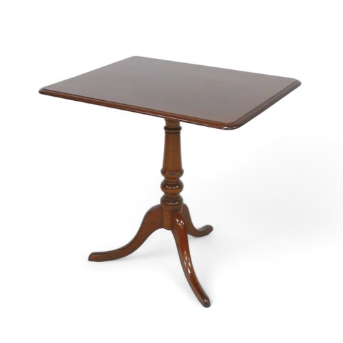 600 - A tripod tilt top tea table, 76 by 60 by 73cm high.