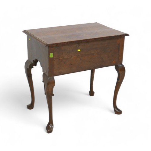 628 - A walnut lowboy, with three small drawers and cabriole legs, 73 by 47 by 73cm high.