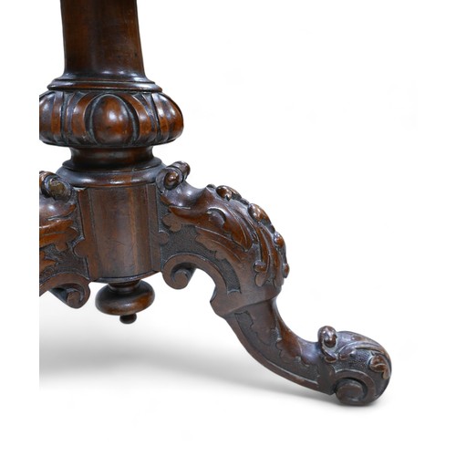 595 - A Victorian carved walnut revolving piano music stool, 43cm by 43cm by 44cm.