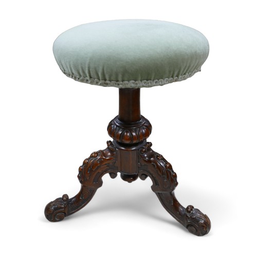 595 - A Victorian carved walnut revolving piano music stool, 43cm by 43cm by 44cm.