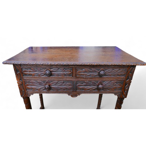 601 - An 18th century oak lowboy, with later carved decoration, two over one drawers.