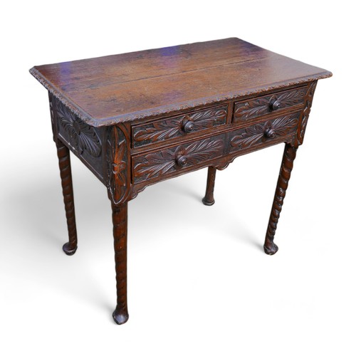 601 - An 18th century oak lowboy, with later carved decoration, two over one drawers.