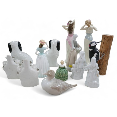 49 - A group of figurines, including Royal Doulton, 'HN4196', 'HN4197', 'HN4308' and 'HN2340'; a Lladro d... 