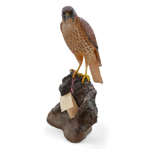 128 - A group of three resin sculptures, including 'Kestrel' by John Moore, JM 194 L, a Border Fine Arts p... 