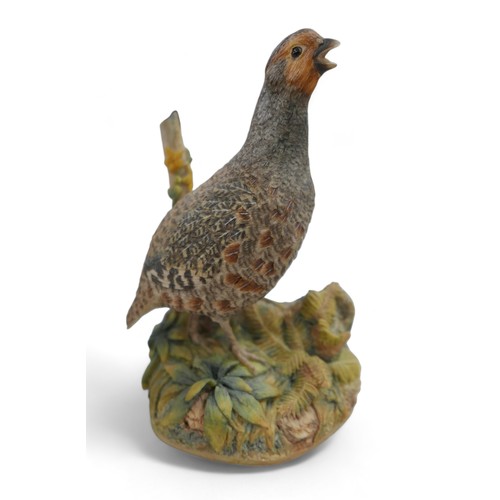 128 - A group of three resin sculptures, including 'Kestrel' by John Moore, JM 194 L, a Border Fine Arts p... 