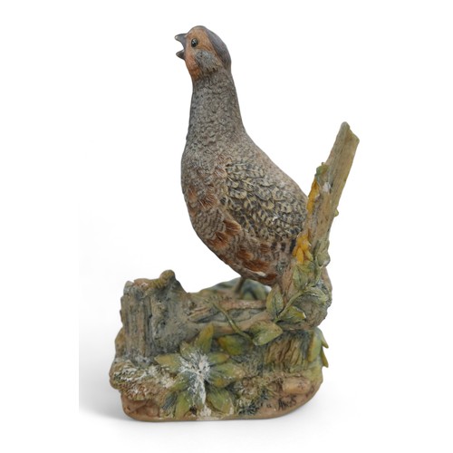 128 - A group of three resin sculptures, including 'Kestrel' by John Moore, JM 194 L, a Border Fine Arts p... 