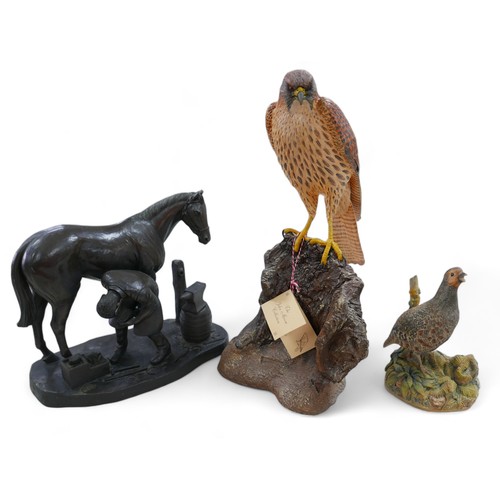 128 - A group of three resin sculptures, including 'Kestrel' by John Moore, JM 194 L, a Border Fine Arts p... 