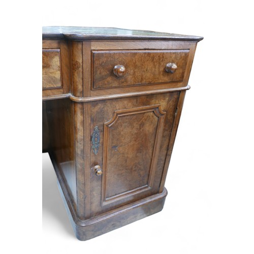 657 - A late Victorian walnut veneered desk, green leather surface, three frieze drawers with turned knobs... 