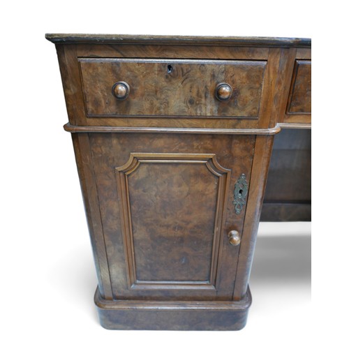 657 - A late Victorian walnut veneered desk, green leather surface, three frieze drawers with turned knobs... 