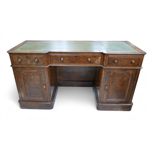 657 - A late Victorian walnut veneered desk, green leather surface, three frieze drawers with turned knobs... 