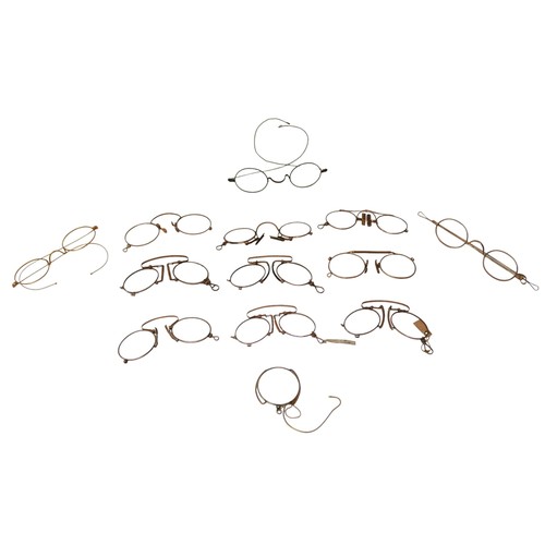 126 - A collection of 19th century and later spectacles and pince nez, together with one monocle, some wit... 