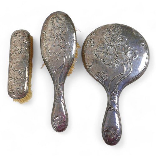 133 - A mixed group of silver and plated items, including three piece, silver backed brush ad mirror set, ... 