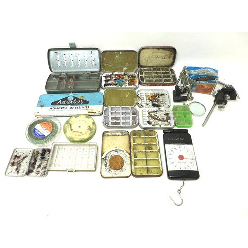 169 - A collection of assorted fly fishing flies and fly making equipment.