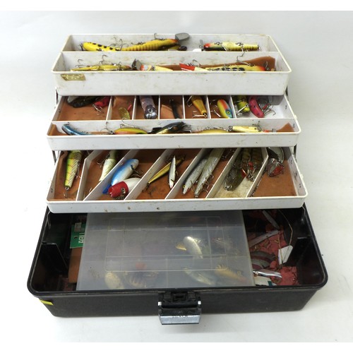 173 - A collection of spoon and bait fishing lures, approximately 50 in total, contained in a folding case... 