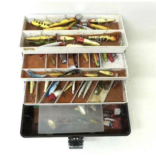 173 - A collection of spoon and bait fishing lures, approximately 50 in total, contained in a folding case... 