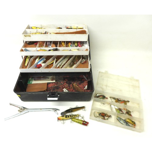 173 - A collection of spoon and bait fishing lures, approximately 50 in total, contained in a folding case... 