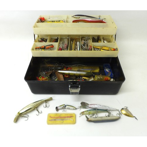 174 - A collection of spoon and bait fishing lures, approximately 50 in total, contained in a folding case... 