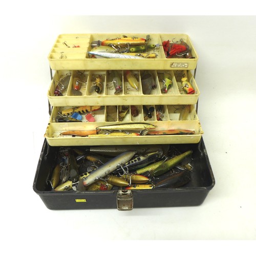 175 - A collection of spoon and bait fishing lures contained in a folding case, including Shakespeare, app... 