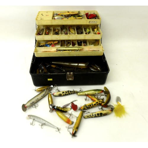 175 - A collection of spoon and bait fishing lures contained in a folding case, including Shakespeare, app... 