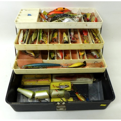 176 - A collection of spoon and bait fishing lures, approximately 50 in total, contained in a folding case... 