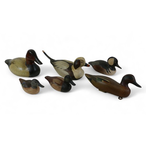 116 - A group of six decoys, comprising a float decoy painted by R. L. Jeeves, three by Hutch Decoy Carvin... 