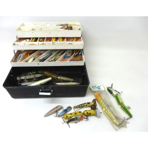 180 - A collection of spoon and bait fishing lures, approximately 80 in total, contained in a folding case... 