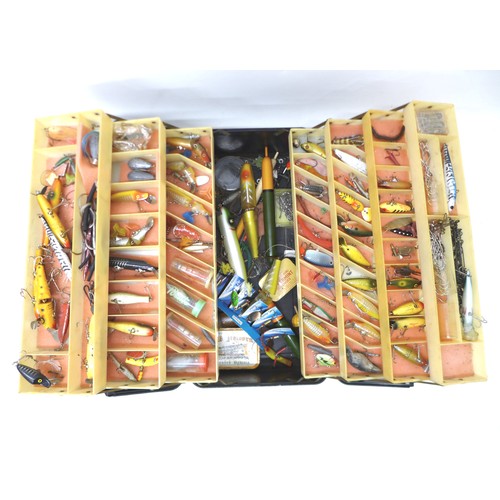 182 - A collection of spoon and bait fishing lures, approximately 80 in total, contained in a folding case... 