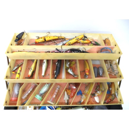 182 - A collection of spoon and bait fishing lures, approximately 80 in total, contained in a folding case... 