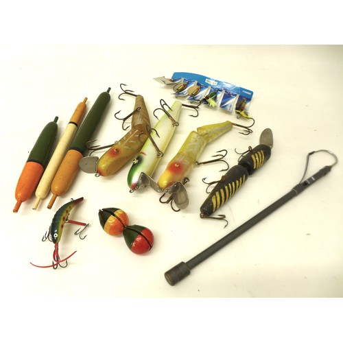 182 - A collection of spoon and bait fishing lures, approximately 80 in total, contained in a folding case... 