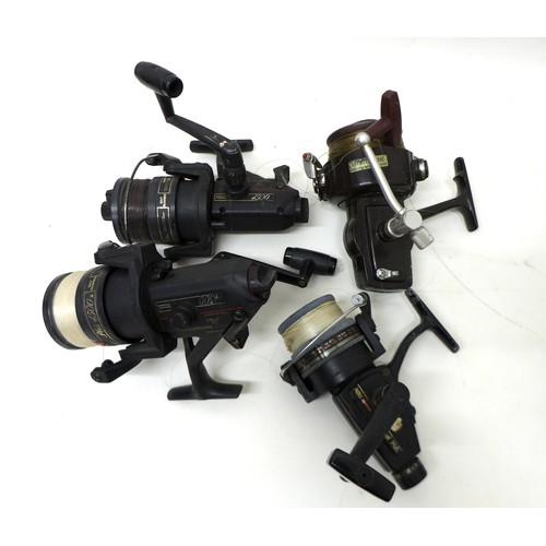 183 - A collection of thirty three spool fishing reels including Shimano Triton Baitrunner, Cardinal 664GT... 