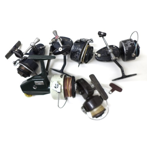 183 - A collection of thirty three spool fishing reels including Shimano Triton Baitrunner, Cardinal 664GT... 